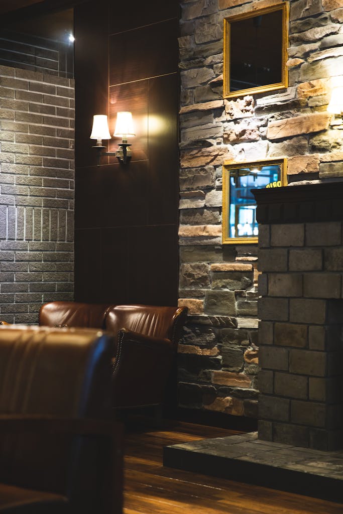 Interior of modern restaurant with stone walls and leather furniture